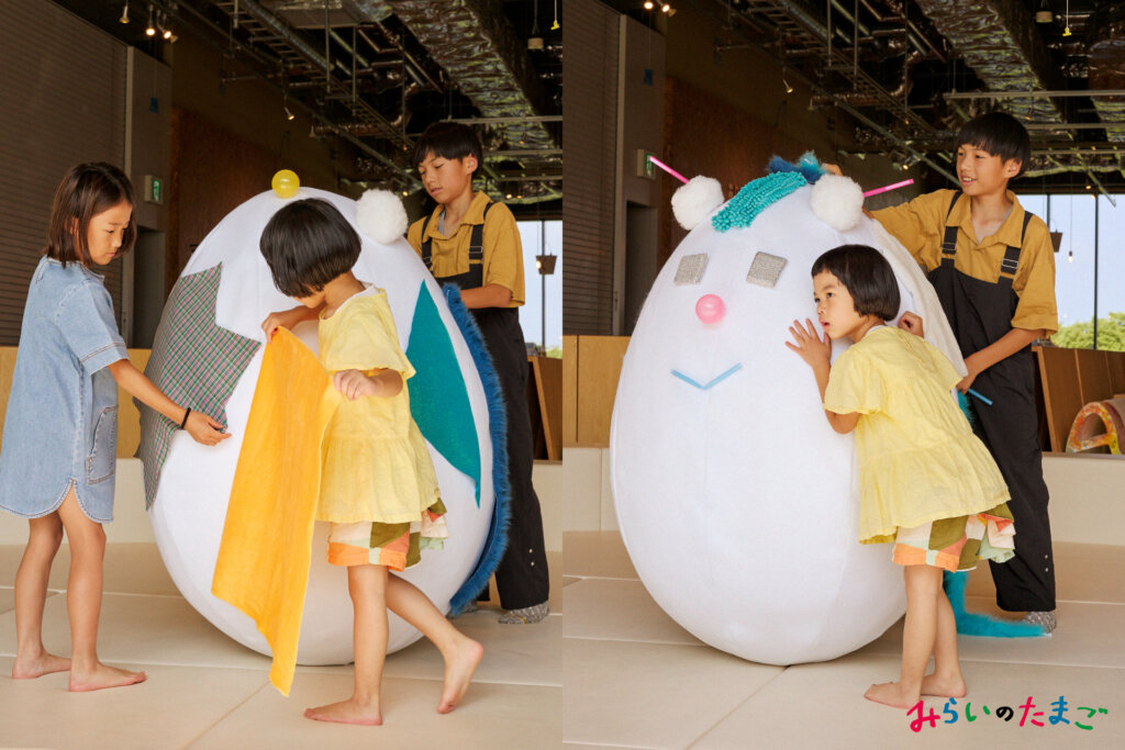 巨大な卵をデザイン、耳を傾ける子どもたち